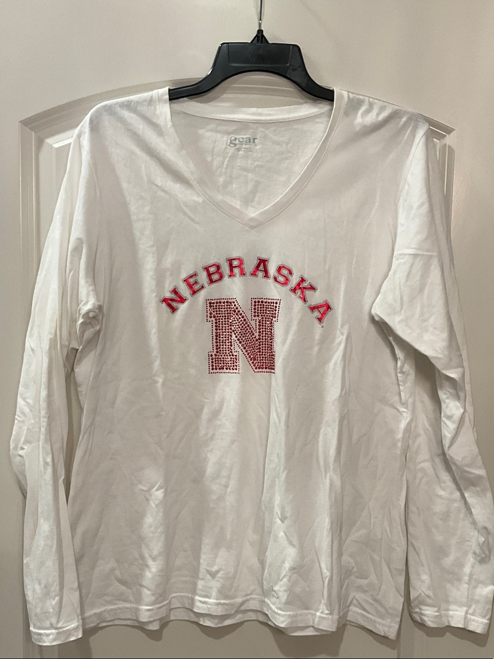 Nebraska V-Neck Long Sleeve Shirt in White with Red Accent